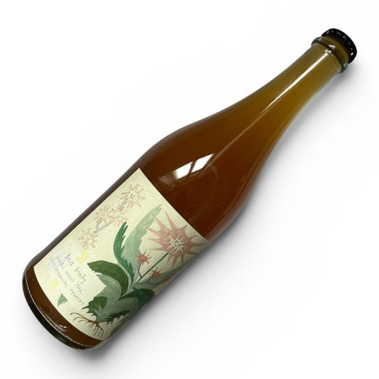 An amber glass bottle with a cream-colored botanical label, shown diagonally on a clean white background.